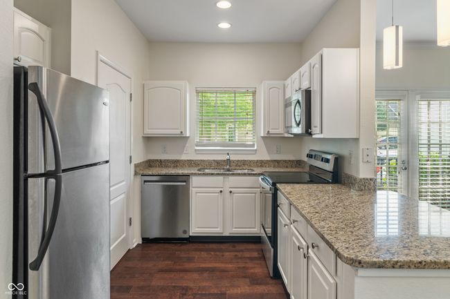 Kitchen upgraded features include new: dishwasher, oven, microwave, plumbing fixtures, painted cabinets, lighting, 1/4 stop plumbing valves | Image 26