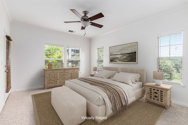 Virtually Staged: The primary bedroom is surrounded by windows forw onderful natural light. | Image 16