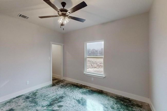 Unfurnished room featuring ceiling fan, baseboards, carpet flooring, and visible vents | Image 26