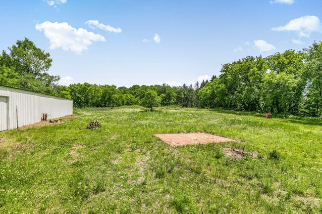 A cleared portion on the 5.3 acre property - paver patio | Image 29