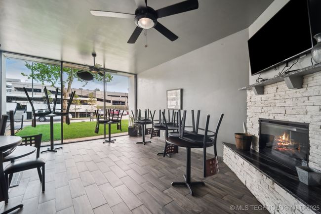 Tables, TV, & Fireplace backside of Market Store | Image 22