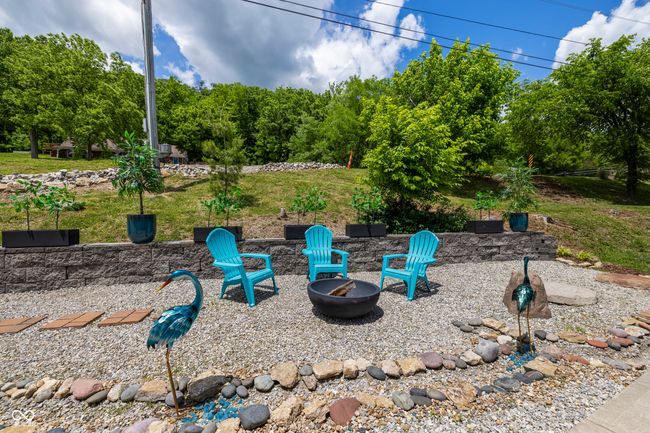 view of yard featuring an outdoor fire pit | Image 65