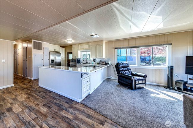 Spacious kitchen with breakfast bar. | Image 7