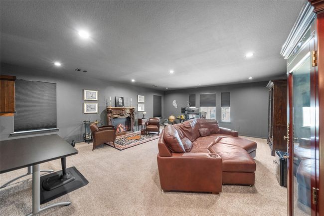 This private bright, carpeted game room upstairs is perfect for relaxation and entertaining. | Image 26
