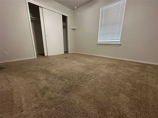 Unfurnished bedroom featuring carpet floors and a closet | Image 24
