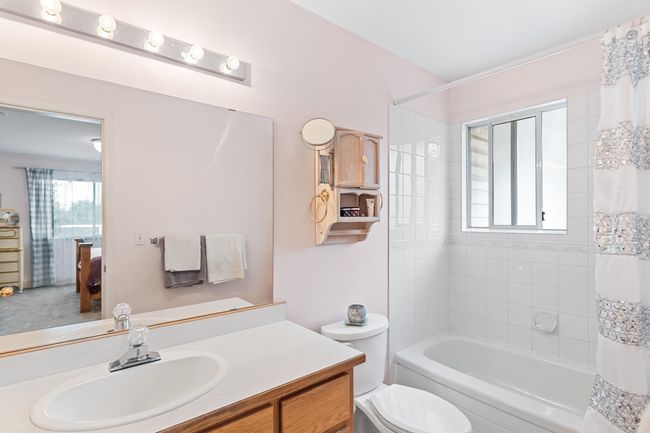 Bathroom with vanity, toilet, shower / tub combo, and ensuite bathroom | Image 28