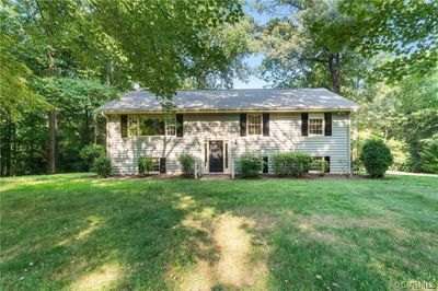 Bi-level home featuring a front yard | Image 1