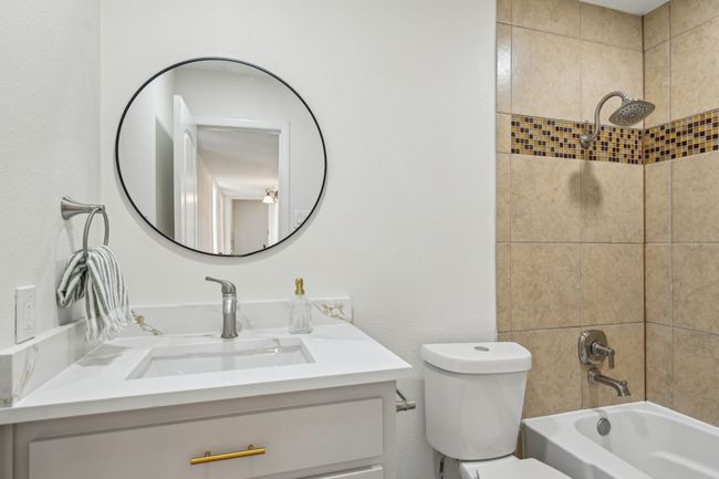 Full bath with vanity, toilet, and shower / bathtub combination | Image 17