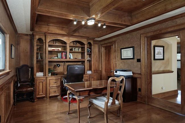 Stately home office with rich wood paneling and built-in desk and shelving. Enjoy amazing views of the golf course! | Image 27