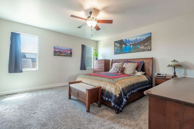 Carpeted bedroom with baseboards and ceiling fan | Image 12
