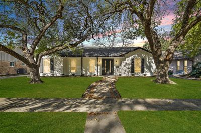 This home features mature trees and lush lawn and sits on a 8, 520 sqft Lot. | Image 2