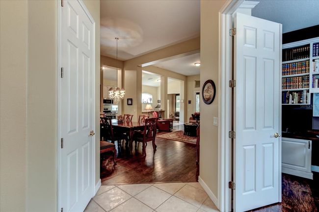 Front foyer to dining and living area, Office to the double doors on right | Image 13
