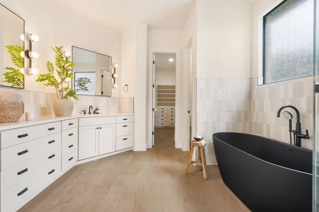 A expansive dual vanity provides plenty of space for two, offering comfort and functionality without compromising on style. | Image 16