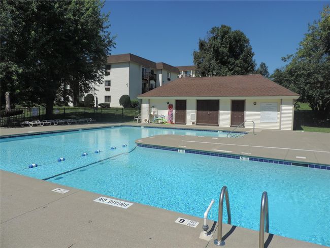 Pool with fence and a patio | Image 12