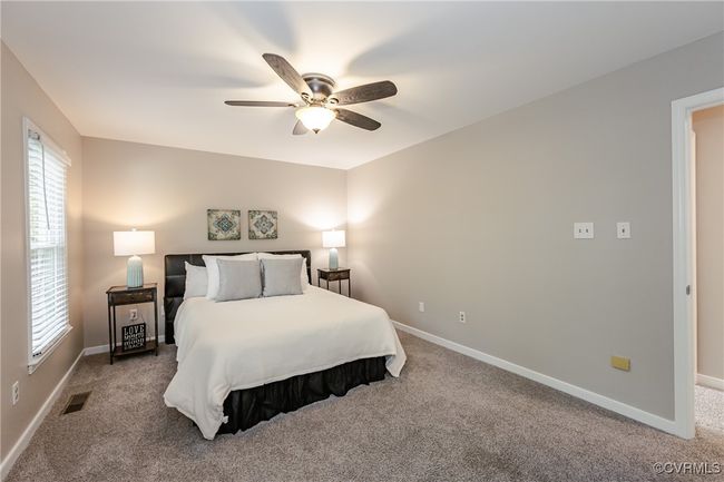 Primary with Carpeted, with visible vents, a ceiling fan, and baseboards | Image 31