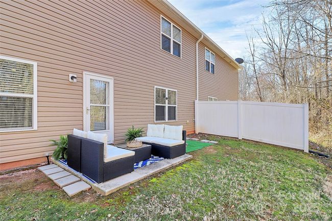 Quiet, large, PRIVATE back yard patio backing up to woods. | Image 14
