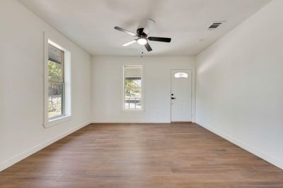 Entrance foyer with light wood-type flooring and ceiling fan | Image 3