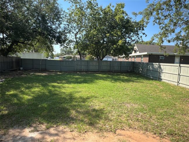 View of yard with a fenced backyard | Image 9
