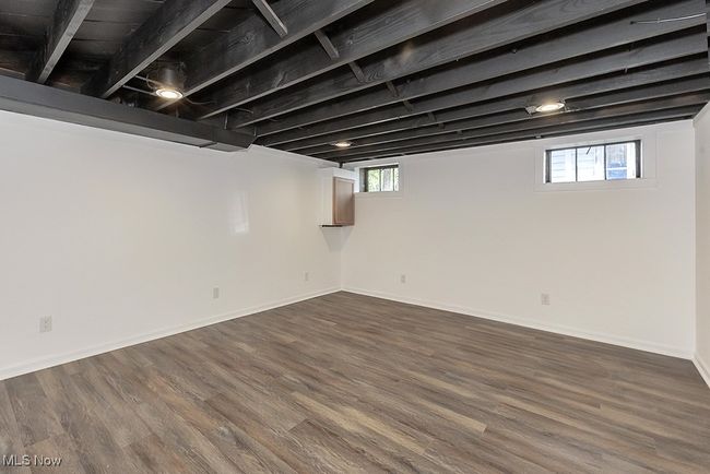 Basement featuring dark wood-type flooring | Image 44
