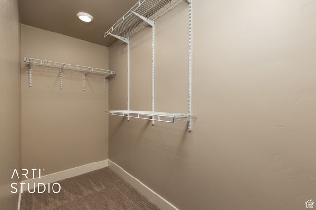 Walk in closet featuring carpet floors | Image 29