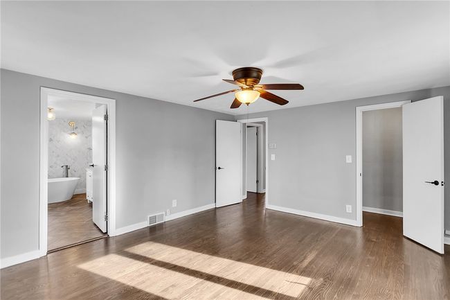 Airy primary with adjacent en suite and large closet | Image 18