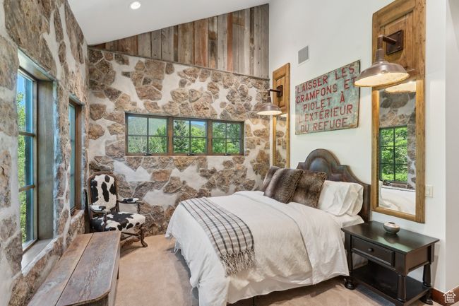 Carpeted bedroom featuring vaulted ceiling | Image 29