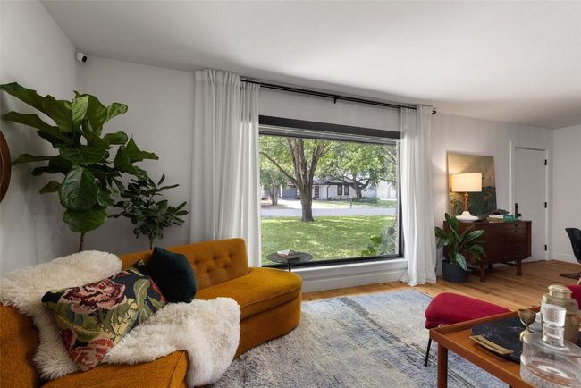 Large, black-framed Andersen picture windows added. | Image 6