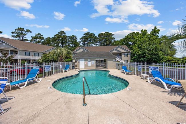 Community pool with a patio area | Image 31