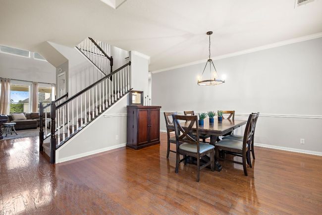 The dining room is beautiful with fresh paint and updated light fixture. | Image 6
