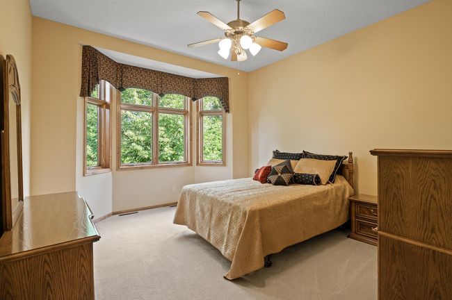 Bay window in the owners suite overlooks the private backyard and pond. | Image 11
