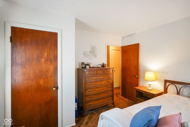 view of carpeted bedroom | Image 21