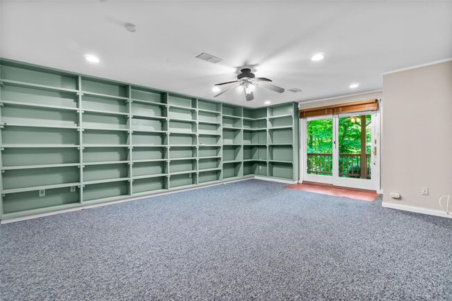 Empty room with carpet flooring, recessed lighting, a ceiling fan, baseboards, and crown molding | Image 27