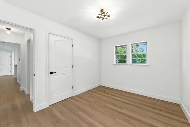 Unfurnished bedroom with light wood-style floors and a closet | Image 20