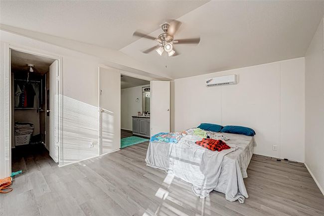 The main bedroom is a spacious featuring great closet space and an en-suite bathroom for added privacy and convenience. | Image 10