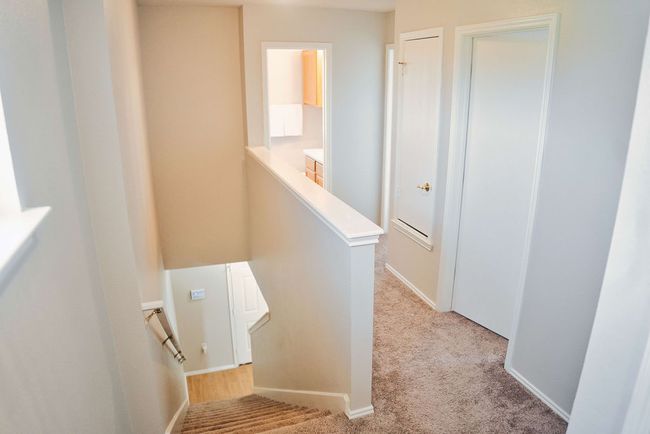 Stairs featuring carpet floors and baseboards | Image 18
