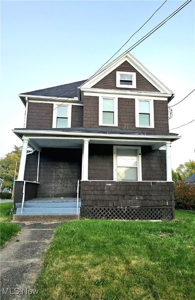 Duplex on Sherman sits on a corner lot. Front porch. | Image 1