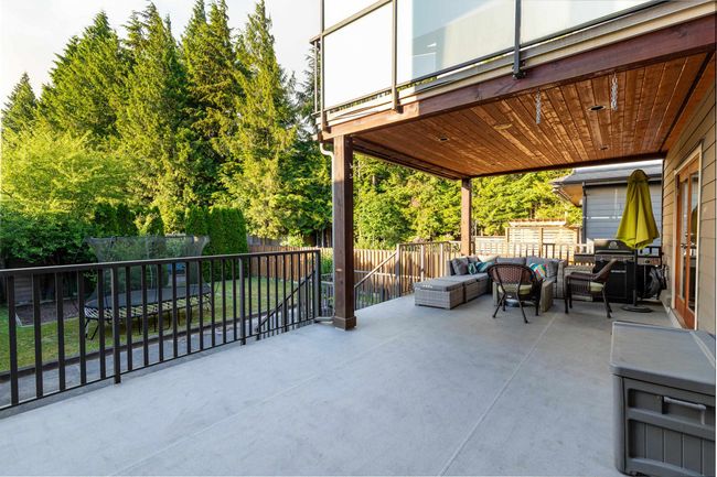Fenced backyard featuring an outdoor hangout area and a patio area | Image 21