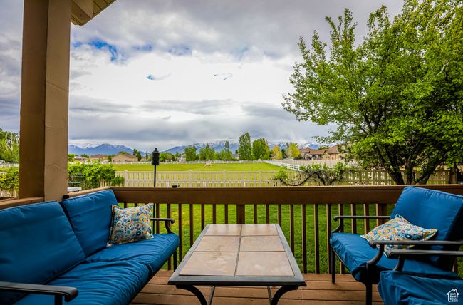 Wooden deck with a mountain view and an outdoor hangout area | Image 46
