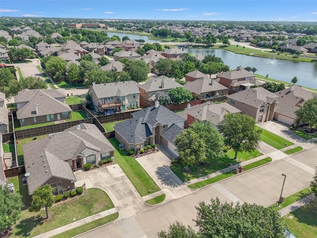 Aerial view of residential area with a large body of water | Image 34