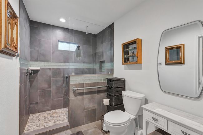 Nice sized bathroom and very pretty shower. | Image 42