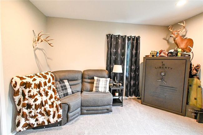 View of carpeted living room | Image 19