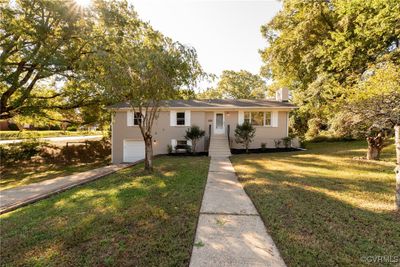 View of front of home with a garage and a front yard | Image 3