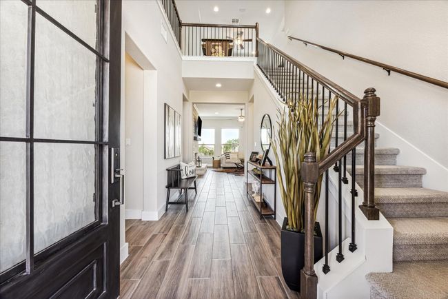 One step inside and the rave reviews begin! Wood plank tile floors cover almost all of the first floor. The owners have ketp the home in immaculate condition. (lucky you!) | Image 5