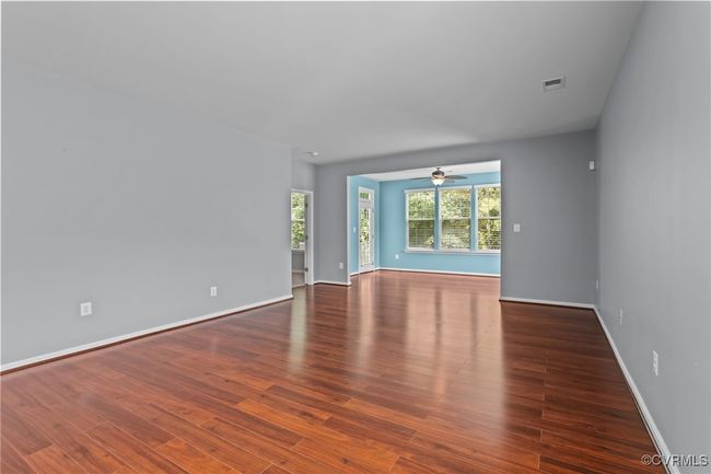 Unfurnished room with a ceiling fan and wood finished floors | Image 10