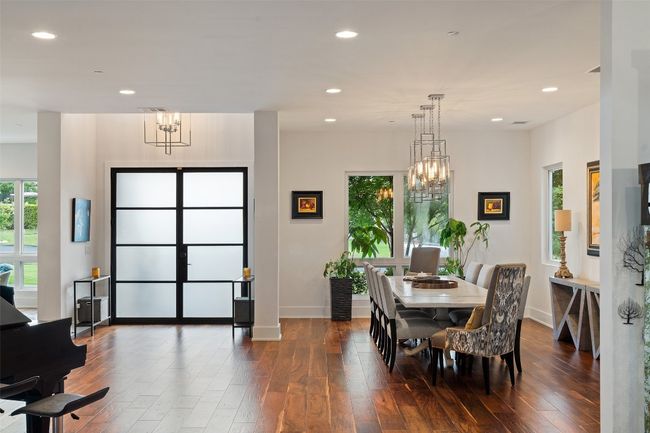 Elegant and bright formal dining just off the main entry, conveniently located for seamless entertaining. | Image 12