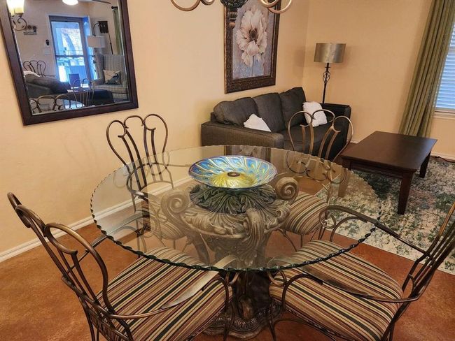 Carpeted dining space featuring baseboards | Image 15