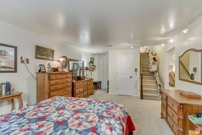 Bedroom with track lighting and light carpet | Image 42