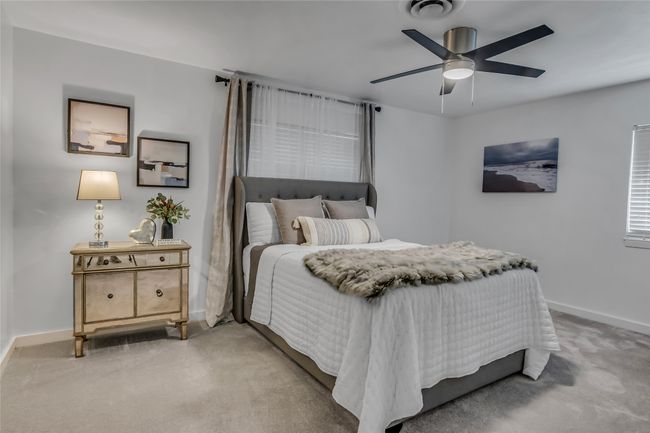 Bedroom featuring light carpet and a ceiling fan | Image 15