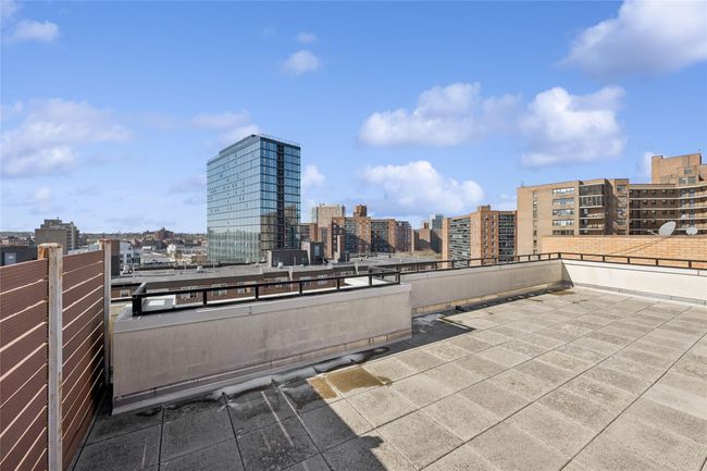 View of patio featuring a balcony and a city view | Image 13