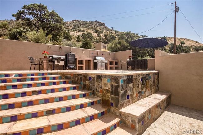 View of patio featuring area for grilling and a mountain view | Image 13